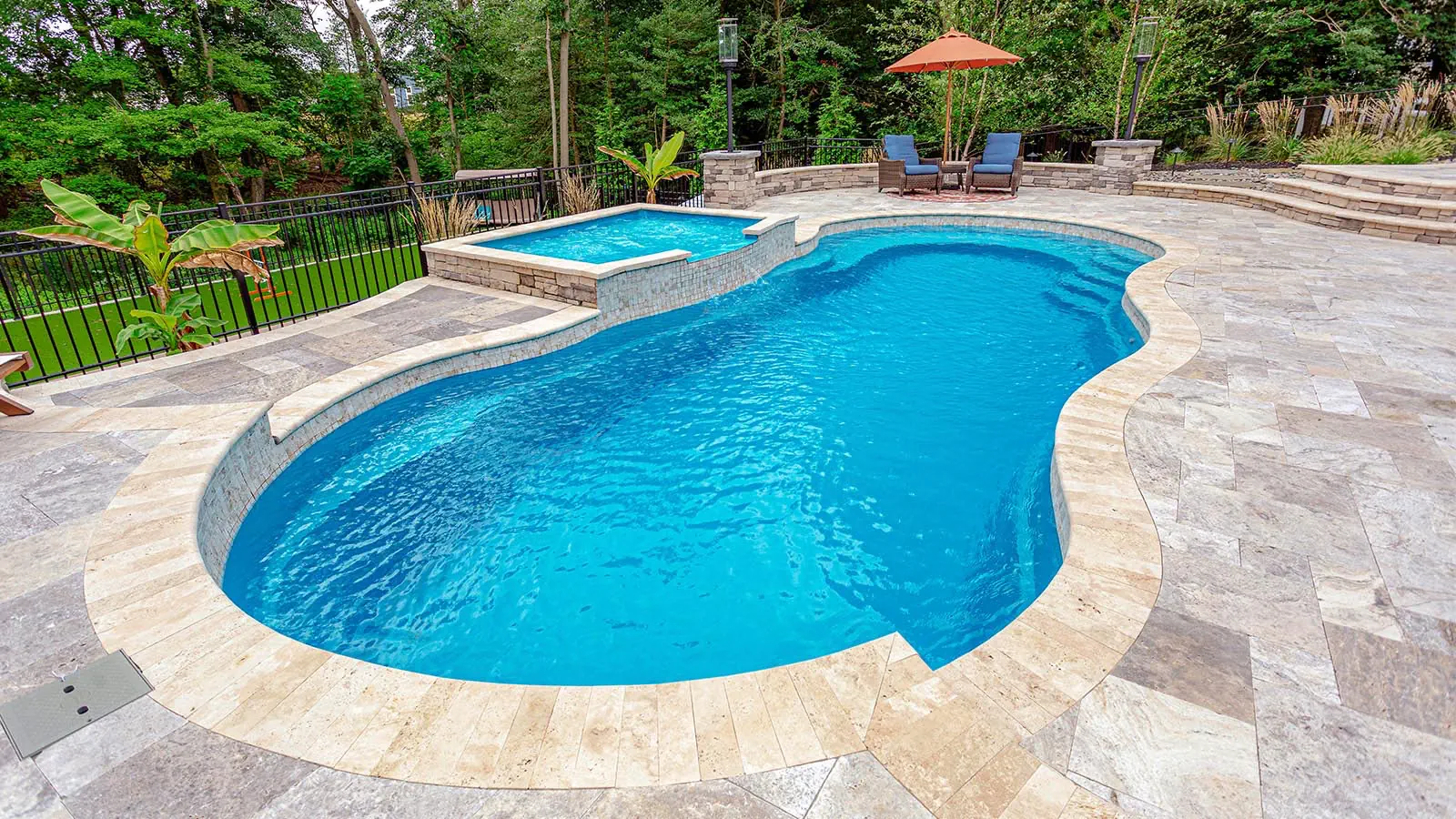A Leisure Pools inground pool with Crystal Blue color